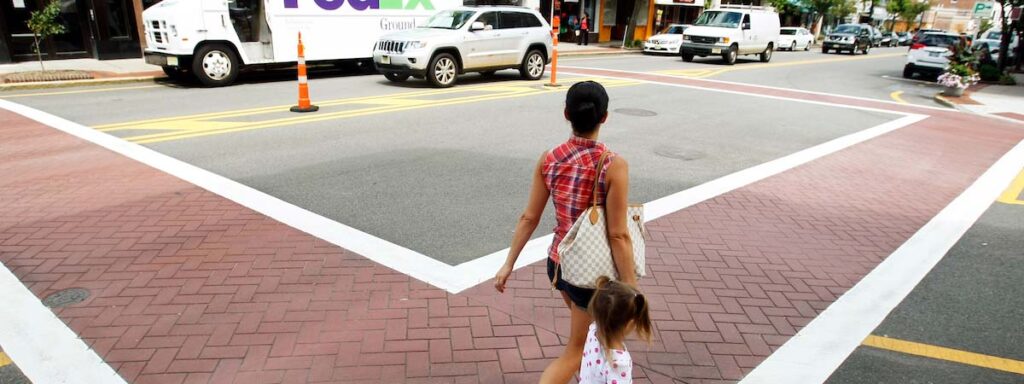 Girl walking through crosswalk